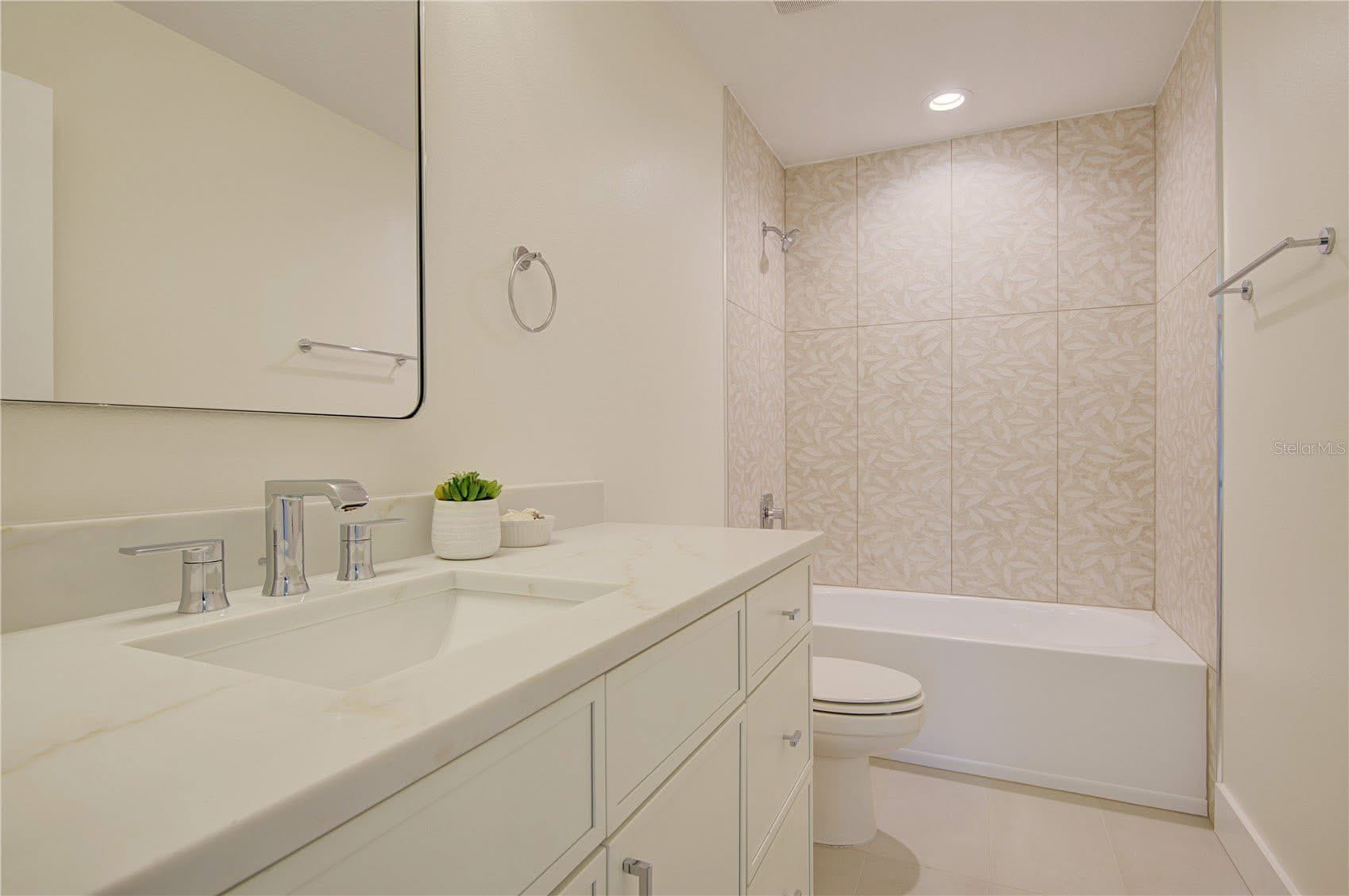 Modern Bath with Patterned Tile Shower