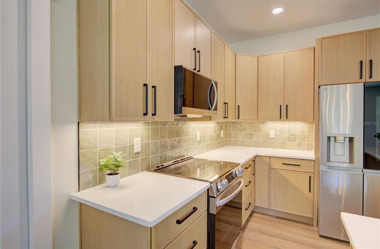 Light Wood Kitchen with Green Backsplash